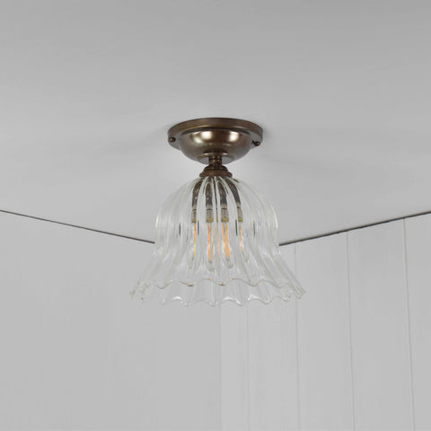 Bodium Small ribbed glass shade flush ceiling light with flower-inspired design and antique brass fitting