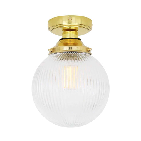 Cherith Bathroom Ceiling Light with ribbed holophane glass globe shade and brass finish, ideal moisture-resistant bathroom fixture