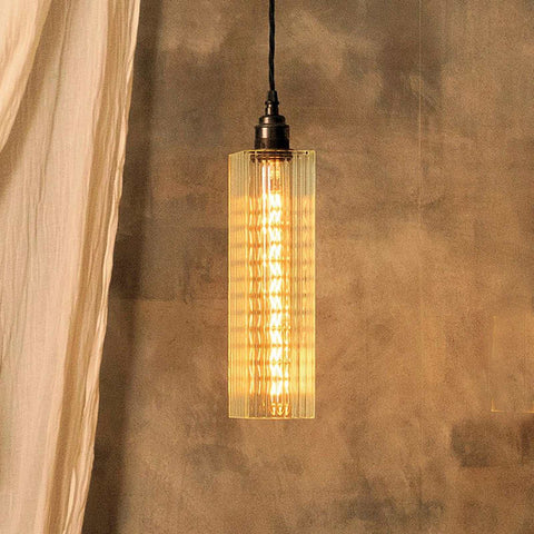Bramley Bathroom Reeded Long Pendant Light with reeded glass and Art Deco design hanging in a stylish interior.