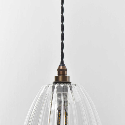 Camber medium ribbed glass shade pendant light with adjustable black twisted cord and bronze fixture
