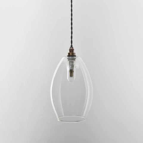 Camber Medium Clear Glass pendant light with adjustable cord and vintage bulb for bathroom lighting