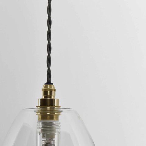 Camber Medium Clear Glass pendant light with brass fittings and twisted black cord for bathroom lighting