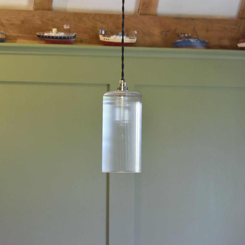 Brook small ribbed glass shade pendant light with handblown cylindrical design hanging in bathroom setting