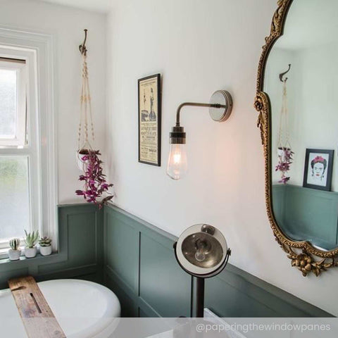 Bo Bathroom Wall light with industrial design, dimmable, waterproof, clear teardrop glass shade mounted in modern bathroom setting