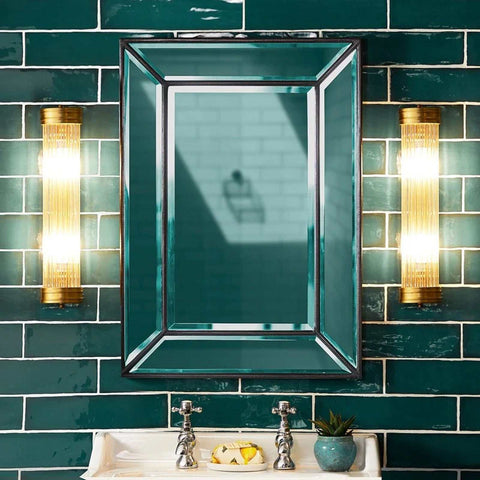 Pooky Long Roddy bathroom wall lights with gold finish and glass rods flanking a rectangular mirror on teal tiled wall