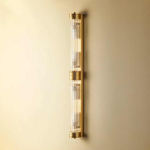 Pooky Rodtastic Bathroom Wall Light in brass finish with elongated vertical design and clear rods