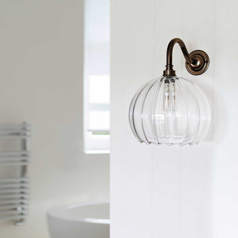 Soho medium ribbed glass shade bathroom wall light with antique bronze fixture and ribbed clear glass shade
