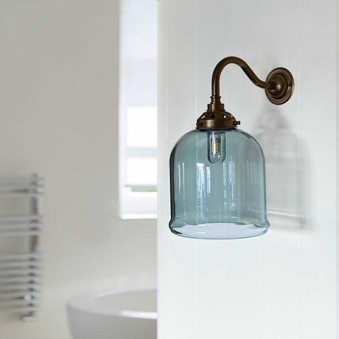 Hythe small smoked glass shade bathroom wall light with swan neck brass arm and clear bulb