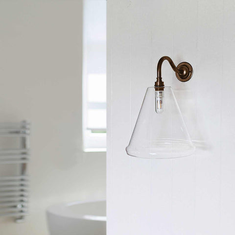 Rye medium clear glass shade bathroom wall light with bronze swan-neck fitting and exposed bulb design