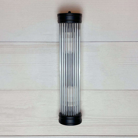 Modern black reeded bathroom wall light with glass rods and G9 bulbs for stylish mirror illumination