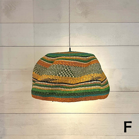 Woven colourful basket pendant light made of natural elephant grass with vibrant stripes hanging ceiling lamp
