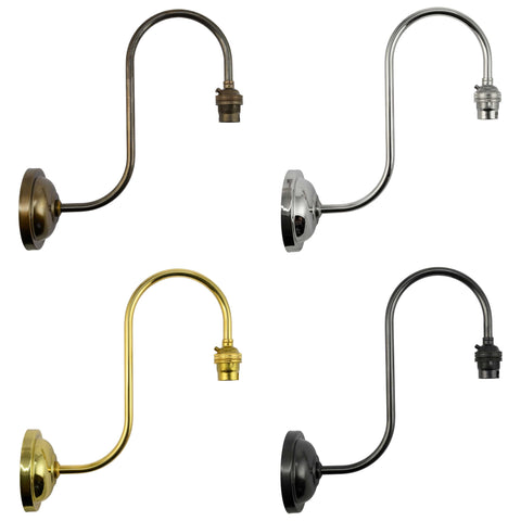 Camber Medium Clear Glass Shade wall light fixture in four metal finishes with curved arm design for versatile home lighting