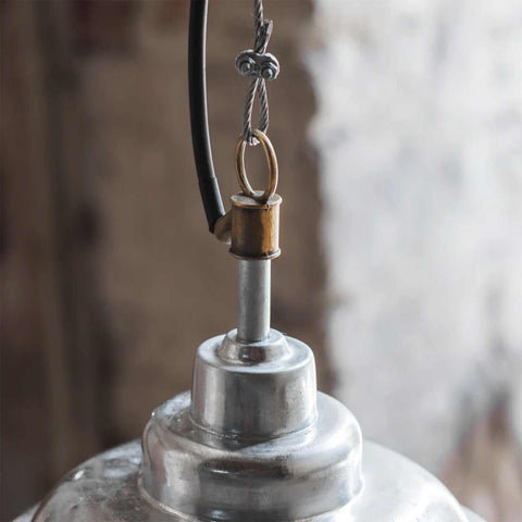 Close-up of St Ives Mariner Pendant Light showing galvanized steel shade and raw cast brass connector in rustic nautical design