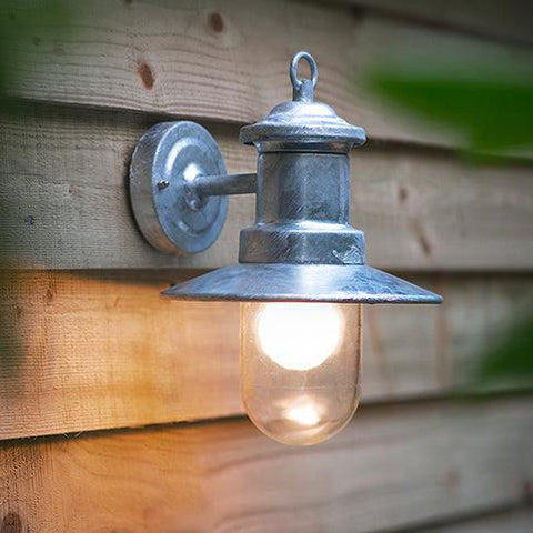 St Ives Outdoor Ships Light hot-dipped galvanised steel wall light with glass shade mounted on wooden exterior wall