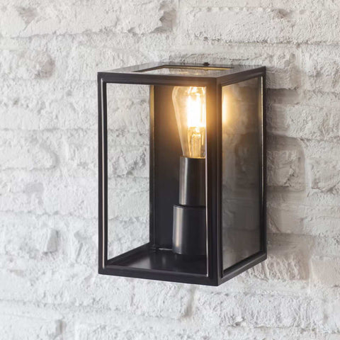 Belgrave Outdoor Lantern small black metal wall light with clear glass on white brick wall