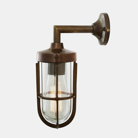Cladach Outdoor Wall Light in solid brass with vintage cage design and clear glass shade