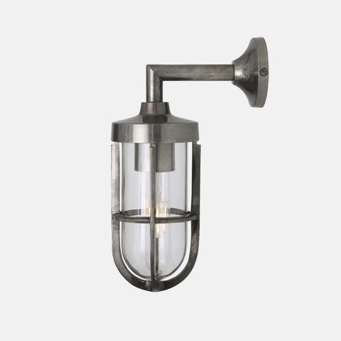 Cladach Outdoor Wall Light in solid brass with industrial design and clear protective glass, weatherproof and suitable for outdoor use