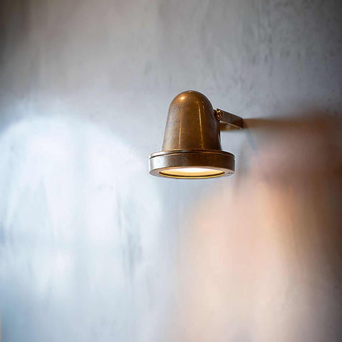 Thames Outdoor Spot Light wall-mounted raw brass outdoor LED spotlight with adjustable swivel and waterproof design
