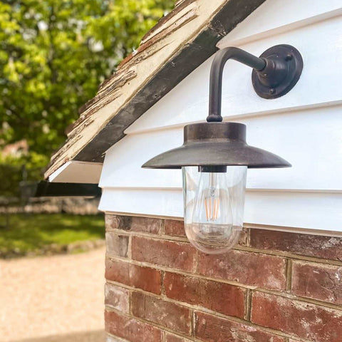 Nabucco Outdoor Wall Light small aged copper and brass finish mounted on exterior brick wall
