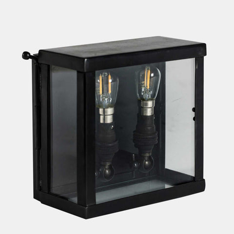 Chiswick outdoor double lamp wall light with black metal frame and clear glass panels, featuring two vintage-style bulbs.