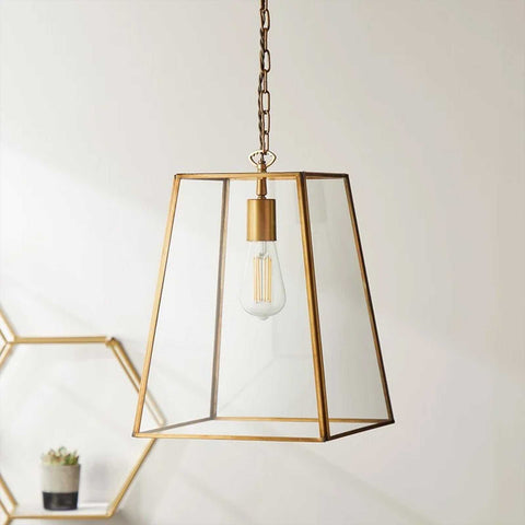 Large Luxor Lantern Pendant Light with clear glass panels and antique brass frame hanging from ceiling chain