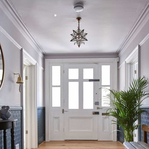Pooky Stella Star Pendant Light medium clear glass star-shaped ceiling light in elegant hallway interior