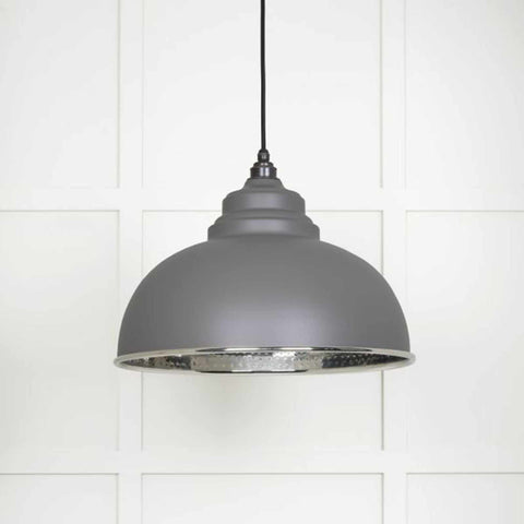 Brampton Grey Pendant Light with domed grey steel shade and polished nickel interior hanging against white paneled wall
