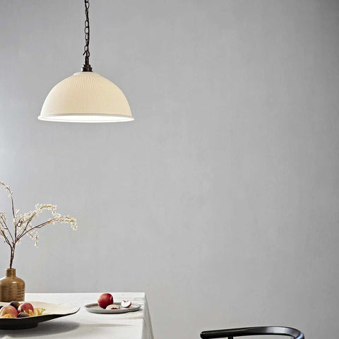 Denton Large Ribbed Ceramic Shade Pendant Light hanging above a dining table with neutral decor