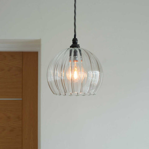 Soho medium ribbed glass shade pendant light with clear ribbed globe hanging in modern interior