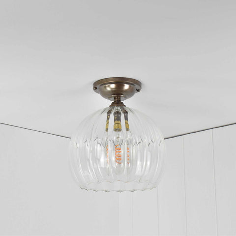 Soho medium ribbed glass shade flush ceiling light with hand-blown clear glass and antique brass fitting for low ceilings