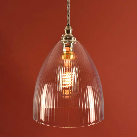 Margate Small Ribbed Glass Shade Pendant Light with hand-blown ribbed glass and vintage filament bulb against warm background