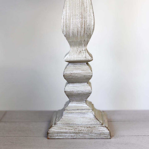 Antique grey Whitwell wooden table lamp base with rustic distressed finish on wooden surface