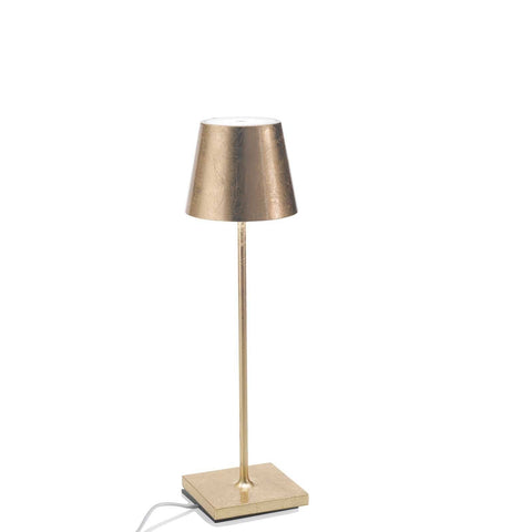 Zafferano Poldina Pro rechargeable gold table lamp with sleek design and portable, long-lasting lighting.
