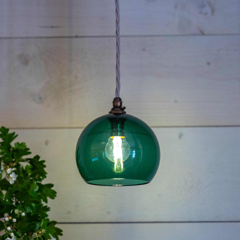 Soho small teal hand-blown glass globe pendant light hanging with visible filament bulb