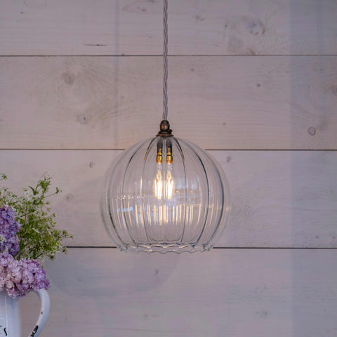 Soho Large Ribbed Glass Shade pendant light with clear ribbed globe design hanging indoors