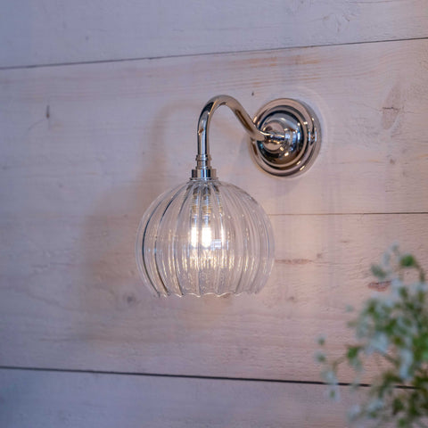 Soho Small Ribbed Glass Bathroom Wall Light with chrome finish mounted on wooden wall
