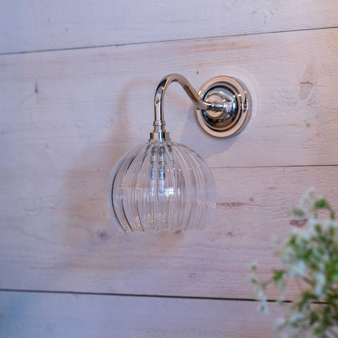 Soho Small Ribbed Glass Bathroom Wall Light with chrome finish mounted on wooden wall