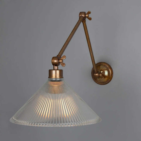 Rebell Prismatic Adjustable Wall Light with prismatic glass shade and antique brass finish