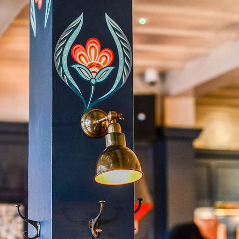 Moorlea Brass Wall Light vintage adjustable brass wall sconce with warm ambient light in stylish industrial design