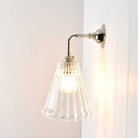 Small Rye ribbed glass shade wall light with curved metal mount and warm diffused glow