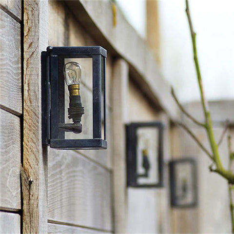 Chiswick Outdoor Wall Light small black cast brass weather-resistant wall-mounted lantern on wooden fence