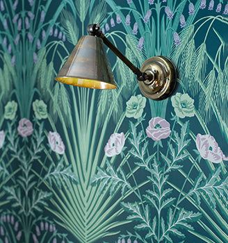 Henley Double Adjustable Wall Light with dual adjustable fittings and metallic shade mounted on floral patterned wall