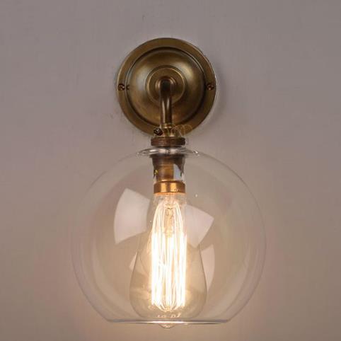 LENHAM Contemporary Wall Light with Clear Glass Shade in Antique Brass