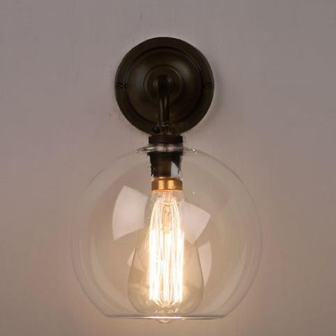 LENHAM Contemporary Wall Light with Clear Glass Shade in Bronze