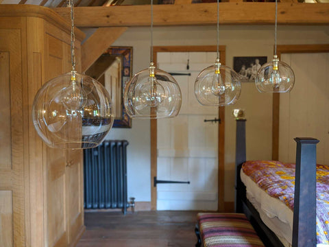Elegant clear glass light shade illuminating bright, stylish interior space