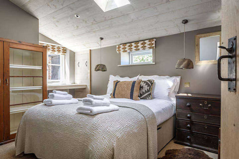 Handmade wall lighting from Cranbrook Collection showcasing British craftsmanship and elegant glass shades