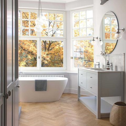 Cranbrook Collection bathroom pendant light over a freestanding bath