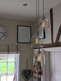 Hythe Small Clear Glass Shade cluster pendant light with handblown clear glass bell-shaped shades