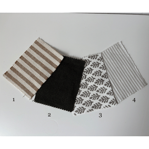 Four fabric swatches with different patterns on a light gray background