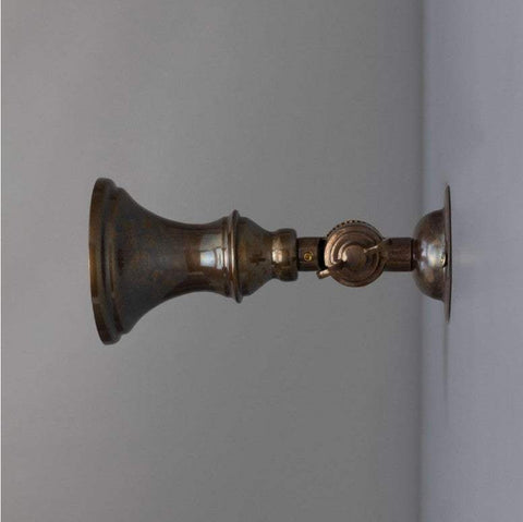 Antique brass finish swatch for Accra Traditional Small Brass Spotlight, showing a warm aged brass tone with subtle vintage patina.